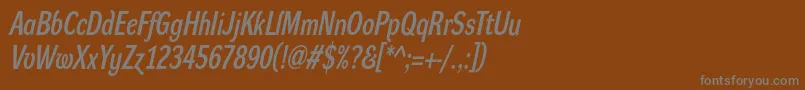 DynagrotesklcBolditalic-fontti – harmaat kirjasimet ruskealla taustalla