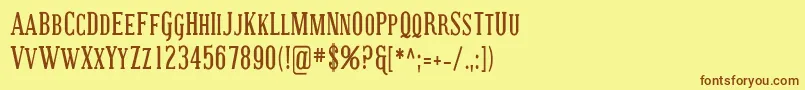 フォントCoving23 – 茶色の文字が黄色の背景にあります。