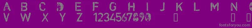 CfnuclearwarRegular-fontti – harmaat kirjasimet violetilla taustalla