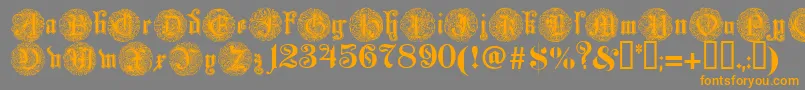フォントMonarchi – オレンジの文字は灰色の背景にあります。
