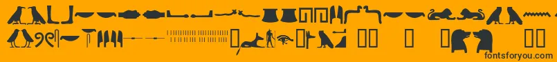 Czcionka Egyptianhieroglyphssilhouet – czarne czcionki na pomarańczowym tle