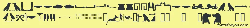 Czcionka Egyptianhieroglyphssilhouet – czarne czcionki na żółtym tle