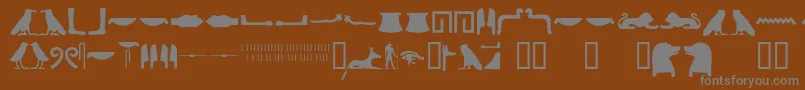 Шрифт Egyptianhieroglyphssilhouet – серые шрифты на коричневом фоне