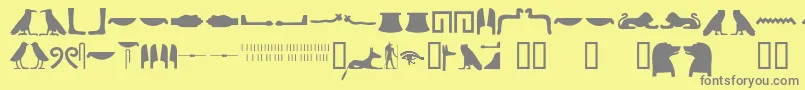 Police Egyptianhieroglyphssilhouet – polices grises sur fond jaune