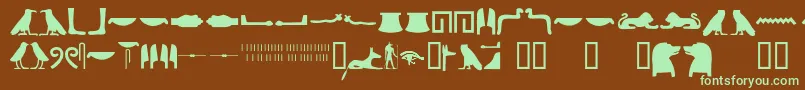 Fonte Egyptianhieroglyphssilhouet – fontes verdes em um fundo marrom