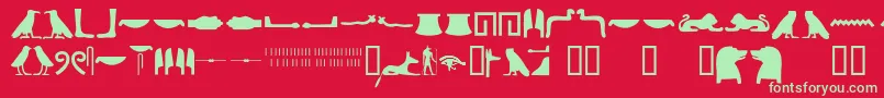 Egyptianhieroglyphssilhouet-Schriftart – Grüne Schriften auf rotem Hintergrund