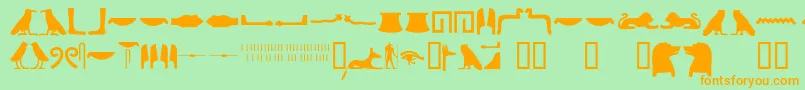 フォントEgyptianhieroglyphssilhouet – オレンジの文字が緑の背景にあります。