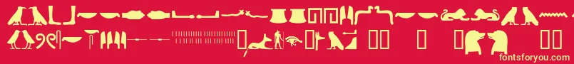 Egyptianhieroglyphssilhouet-fontti – keltaiset fontit punaisella taustalla