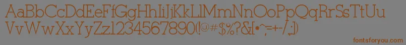 フォントTulang – 茶色の文字が灰色の背景にあります。
