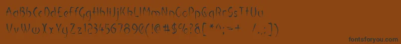 Шрифт LuteousMaximus – чёрные шрифты на коричневом фоне