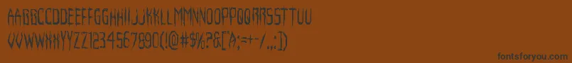 フォントHorroroidcond – 黒い文字が茶色の背景にあります