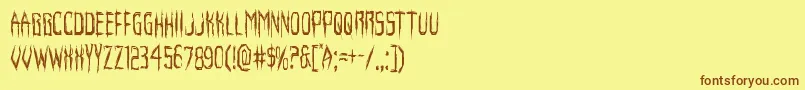 フォントHorroroidcond – 茶色の文字が黄色の背景にあります。