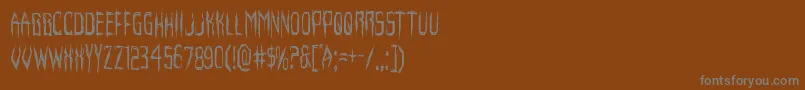 フォントHorroroidcond – 茶色の背景に灰色の文字