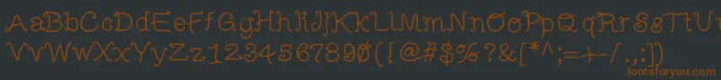 Fonte Mbfunscript – fontes marrons em um fundo preto