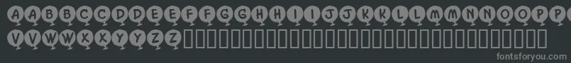 フォントKrHelium – 黒い背景に灰色の文字