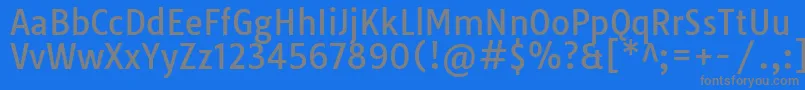 TauriRegular-Schriftart – Graue Schriften auf blauem Hintergrund