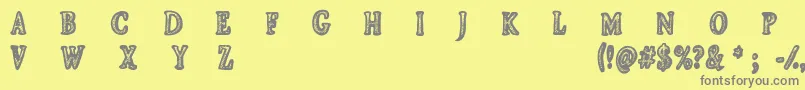 CfjeanscollectionRegular-fontti – harmaat kirjasimet keltaisella taustalla