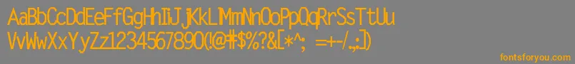 フォントWetalmorker – オレンジの文字は灰色の背景にあります。