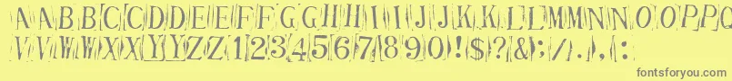 フォントTickci – 黄色の背景に灰色の文字