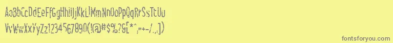 Smellsliketacos-Schriftart – Graue Schriften auf gelbem Hintergrund