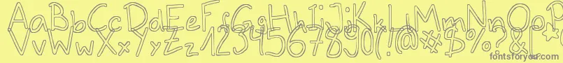 フォントOutlines – 黄色の背景に灰色の文字