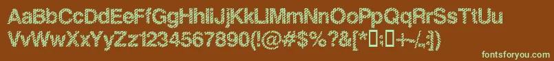 フォントSlankb – 緑色の文字が茶色の背景にあります。