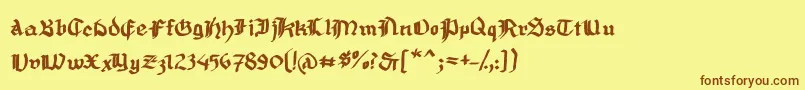 フォントMousefrakturBold – 茶色の文字が黄色の背景にあります。