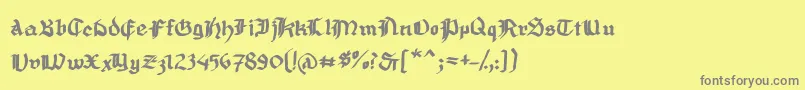 MousefrakturBold-fontti – harmaat kirjasimet keltaisella taustalla