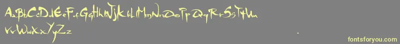 Mgs4Brush-Schriftart – Gelbe Schriften auf grauem Hintergrund