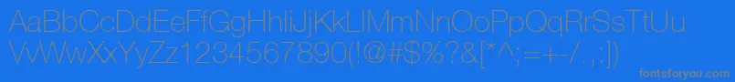HelveticaNeueCe35Thin-fontti – harmaat kirjasimet sinisellä taustalla