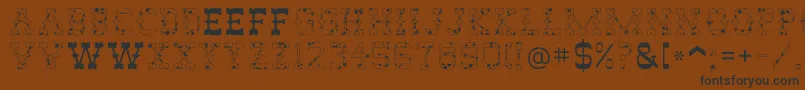 AbileneCow-fontti – mustat fontit ruskealla taustalla