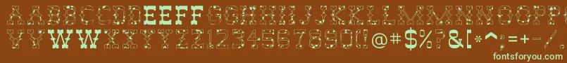 フォントAbileneCow – 緑色の文字が茶色の背景にあります。