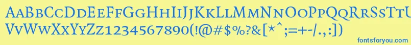 QuadraatSmallcaps Font – Blue Fonts on Yellow Background