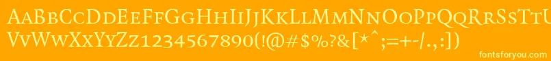 QuadraatSmallcaps Font – Yellow Fonts on Orange Background