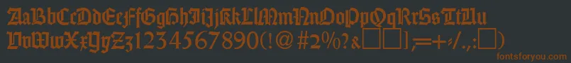 Fonte GothicRegularDb – fontes marrons em um fundo preto