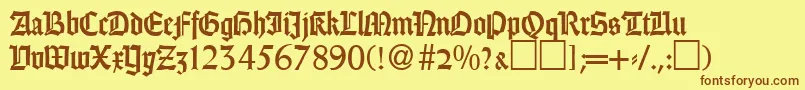 フォントGothicRegularDb – 茶色の文字が黄色の背景にあります。