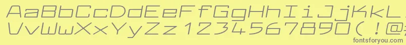 フォントLarabiefontxtItalic – 黄色の背景に灰色の文字