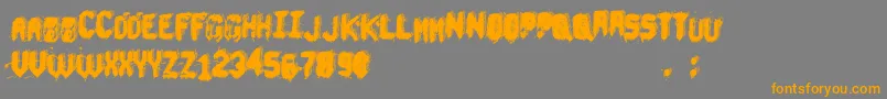 フォントUnderTheBed – オレンジの文字は灰色の背景にあります。