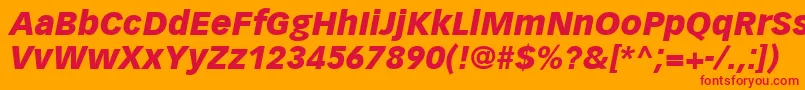 VectoraLt96BlackItalic-fontti – punaiset fontit oranssilla taustalla