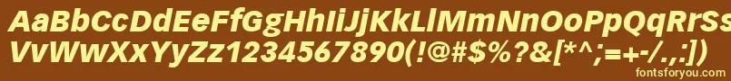 VectoraLt96BlackItalic-fontti – keltaiset fontit ruskealla taustalla