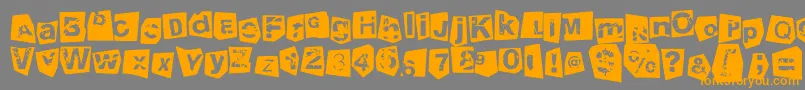 TengoATusHijosNegativo-Schriftart – Orangefarbene Schriften auf grauem Hintergrund