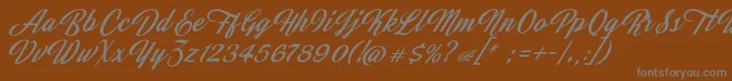 JasmineAndGreentea-Schriftart – Graue Schriften auf braunem Hintergrund