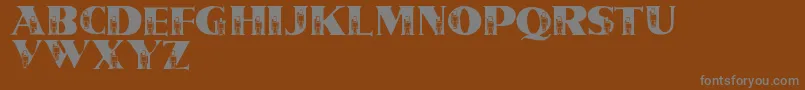 フォントLmsTinSoldiers – 茶色の背景に灰色の文字
