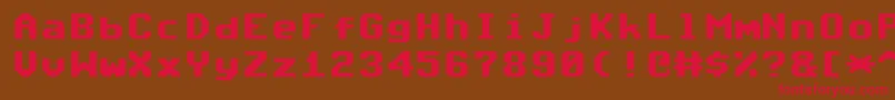 フォントCommodore64Angled – 赤い文字が茶色の背景にあります。