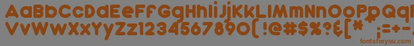 フォントDunkin – 茶色の文字が灰色の背景にあります。