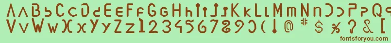 Vegesignes Font – Brown Fonts on Green Background