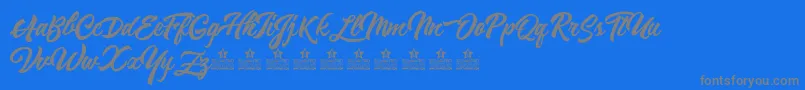 ReminiscentDrivePersonalUse-fontti – harmaat kirjasimet sinisellä taustalla
