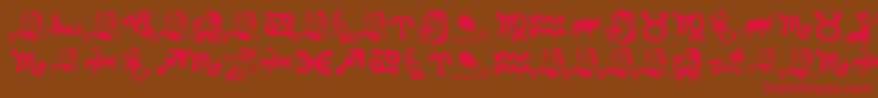 フォントXiloInZodiac – 赤い文字が茶色の背景にあります。