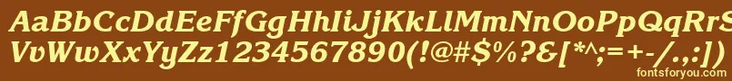 KorinnablacktttItalic-fontti – keltaiset fontit ruskealla taustalla