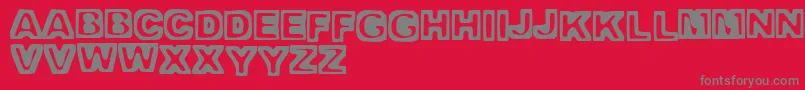 TrappedHeavy Font – Gray Fonts on Red Background